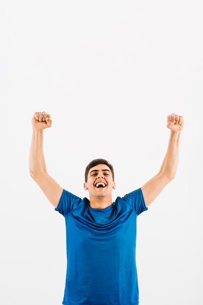 Young football player rejoicing over victory