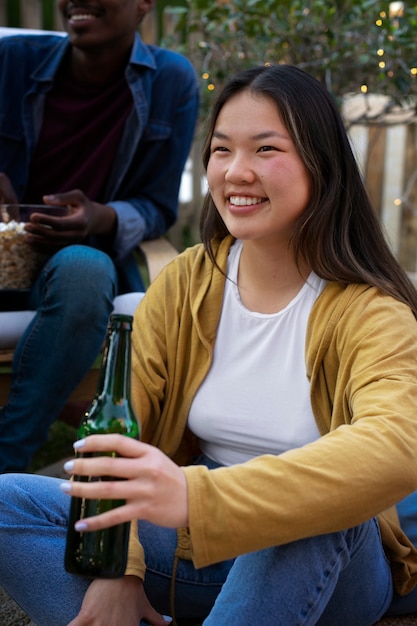 Young friends having fun at cinema in open air