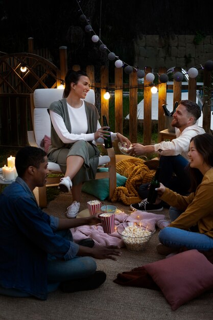 Young friends having fun at cinema in open air