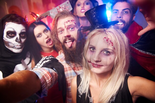 Young friends having fun at Halloween party