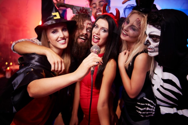 Young friends having fun at Halloween party