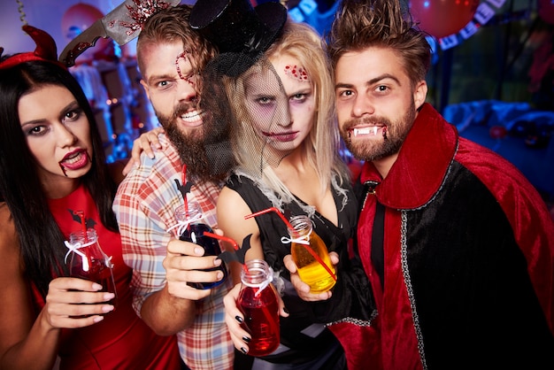 Young friends having fun at Halloween party