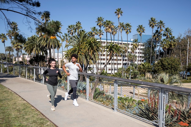 Young friends jogging together