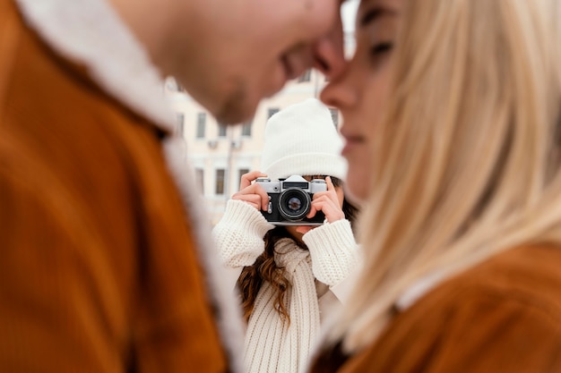 Free photo young friends outdoor taking photos