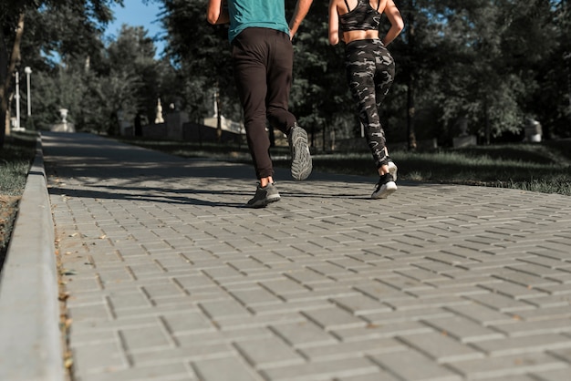 Free photo young friends running in the park