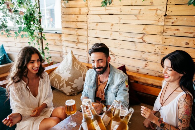 Young friends smiling in bar