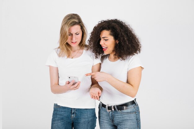 Young friends using smartphone