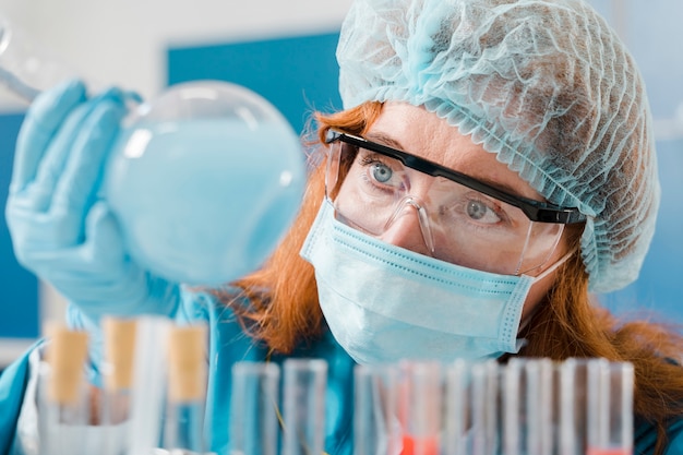 Free photo young ginger woman chemist