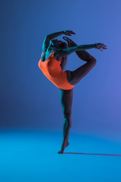 Young girl doing gymnastics exercise isolated