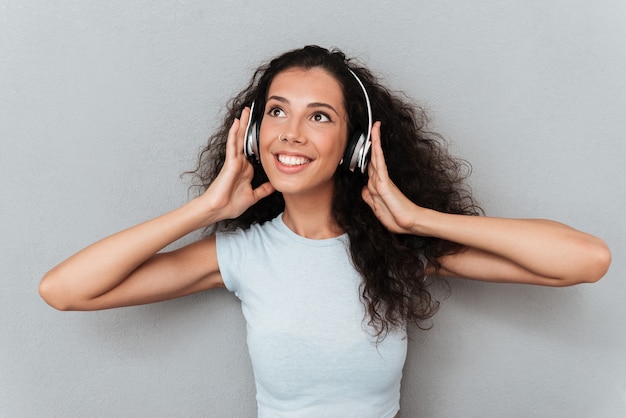 Young girl enjoying music in headphones