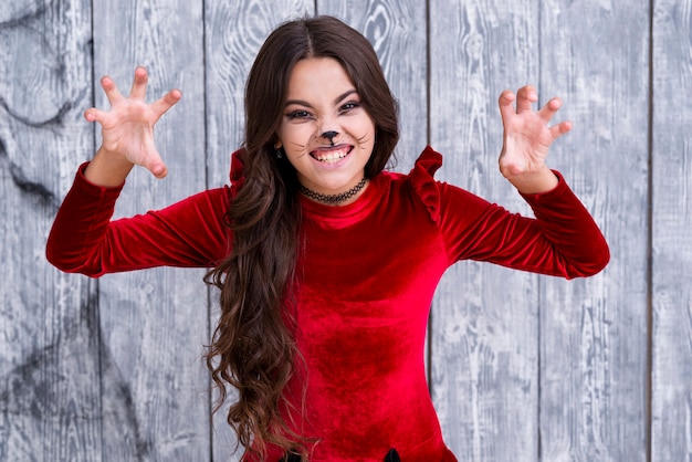 Young girl in halloween costume posing