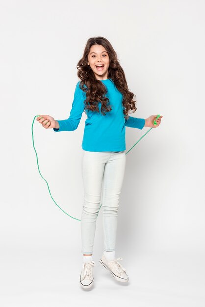 Young girl jumping rope