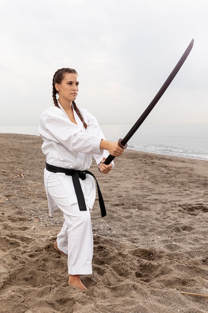 Free Photo young girl in karate outfit training