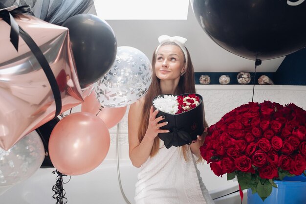 Young girl laughing and enjoying beautiful presents at home