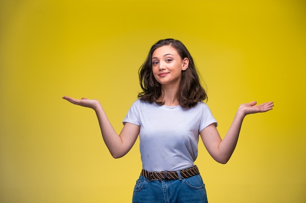 Young girl makes surprized face.