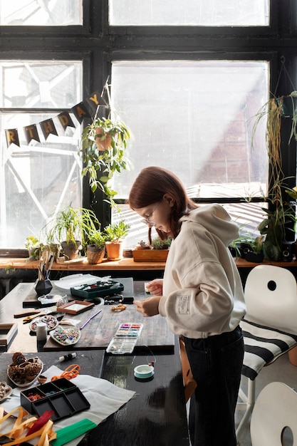 Young girl making diy crafts in upcycle project