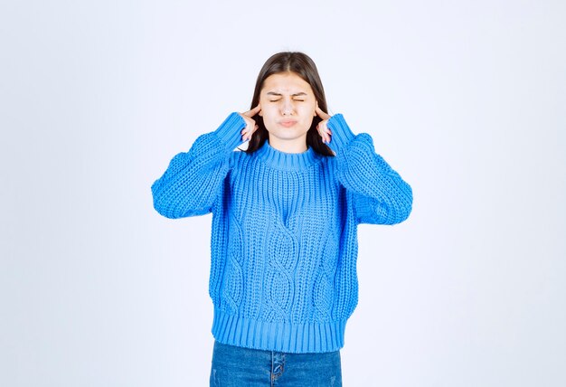 young girl model coning ears with her fingers.