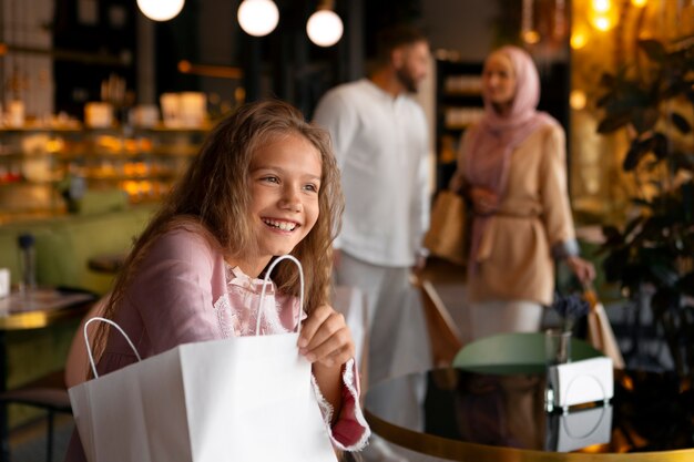 Young girl out for a shopping session with her parents