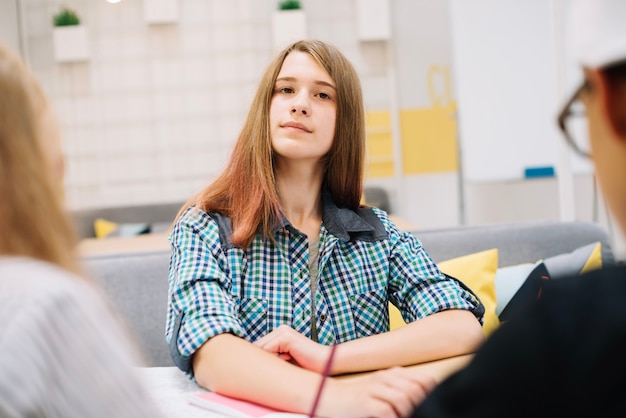 Free photo young girl posing in classroom