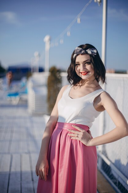 Young girl posing on a seaport