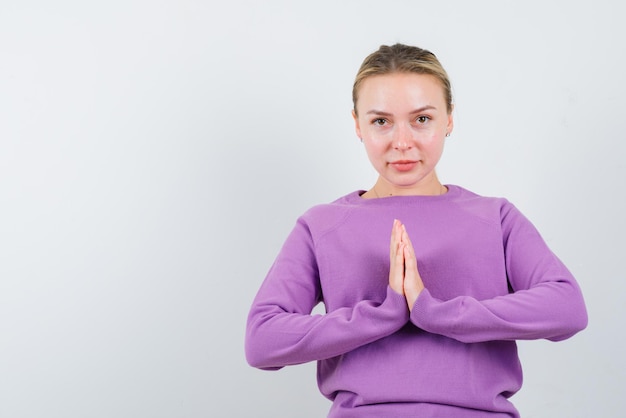 Free Photo young girl praying on white background