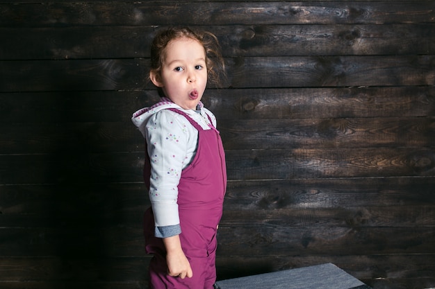 Free photo young girl showing tongue wearing jumpers