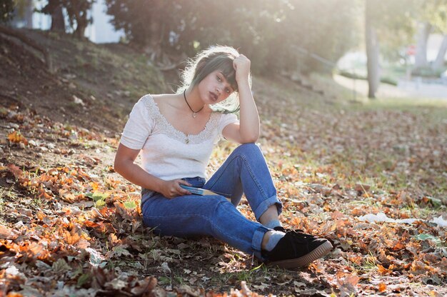 Young girl sitting on a hill