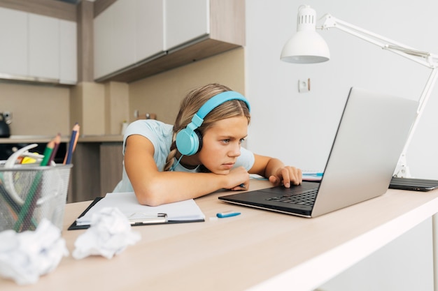 Young girl studying at home