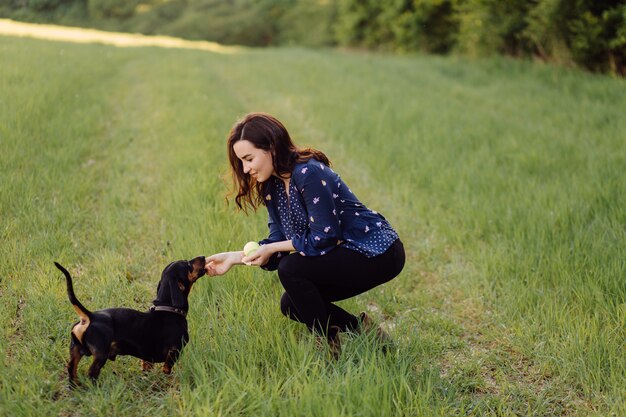 Young girl on a walk with her puppy