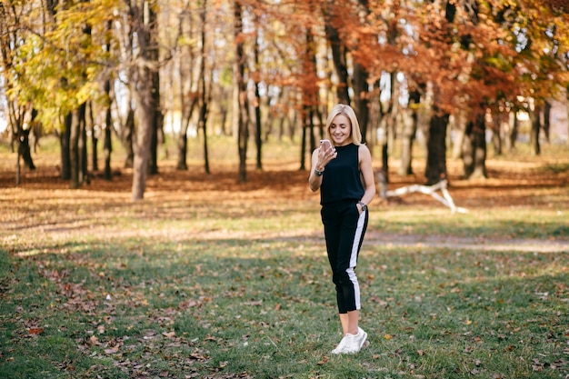 young girl walking in autumn park