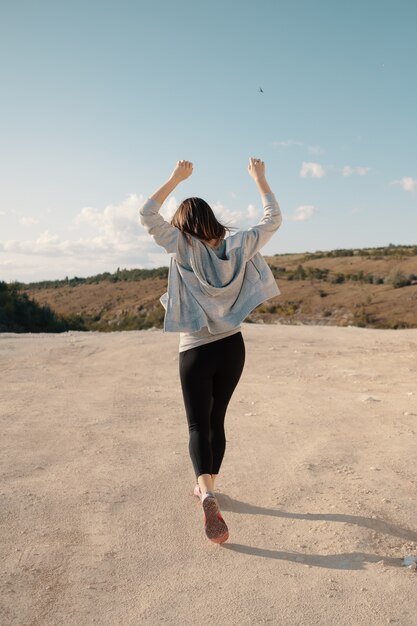 Young girl walks in a career sunny summer evening