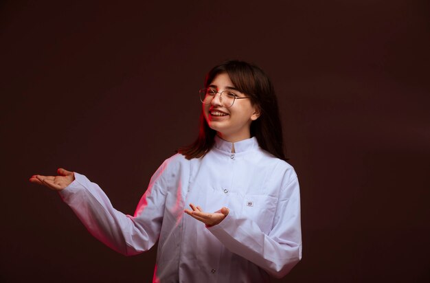 Young girl in white shirt making presentation. 