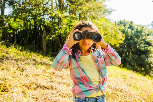 Young girl with binoculars