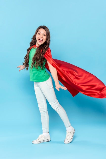 Young girl with hero costume