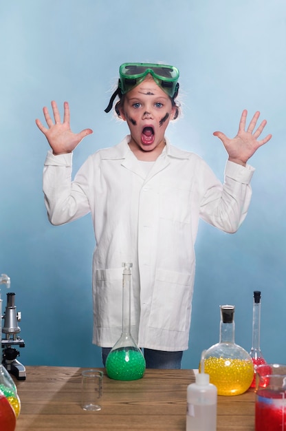 Free Photo young girl with lab coat