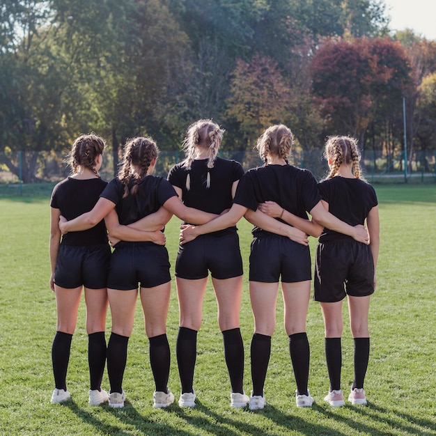 Free Photo young girls standing in a football pitch