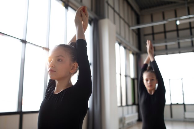 Young girls training together in gymnastics