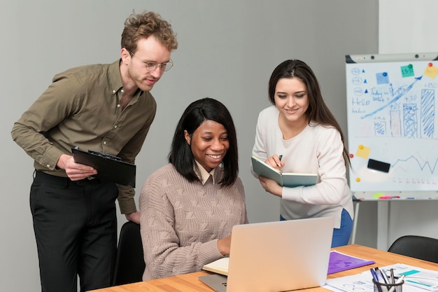 Young group of people teaming up at work