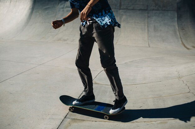 Young guy's legs with skateboard