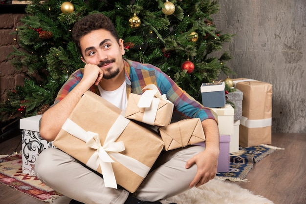 Young guy thinking about gifts.