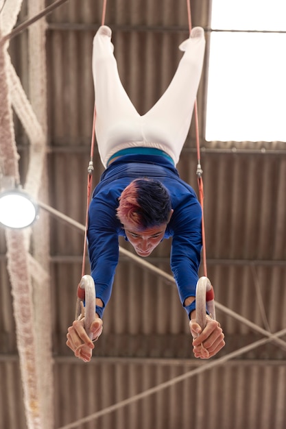 Free photo young gymnast training for competition