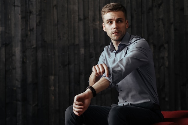 Young handsome businessman posing indoor