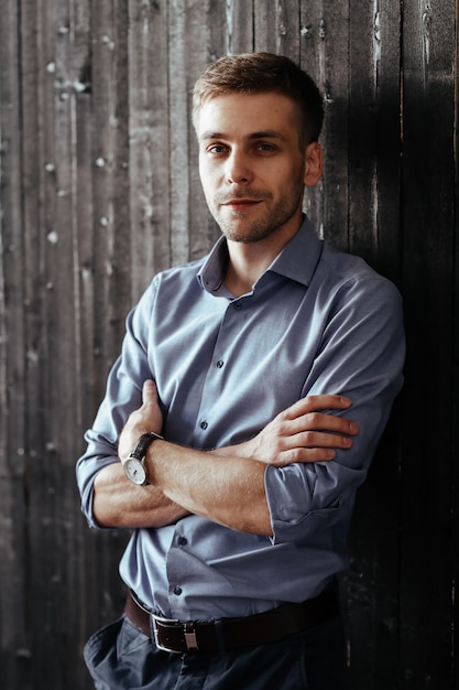 Young handsome businessman posing indoor