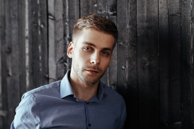 Young handsome businessman posing indoor