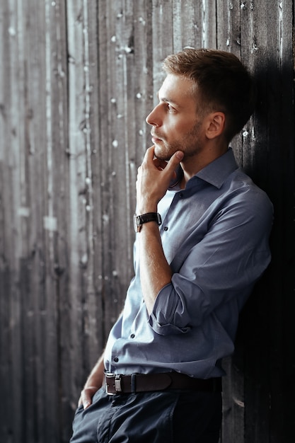 Young handsome businessman posing indoor