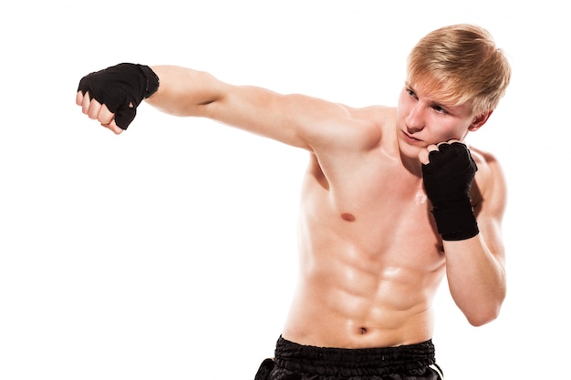 Young handsome fighter in shorts