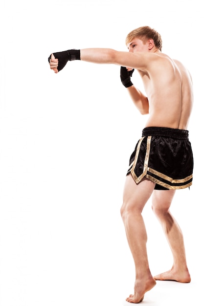 Free photo young handsome fighter in shorts