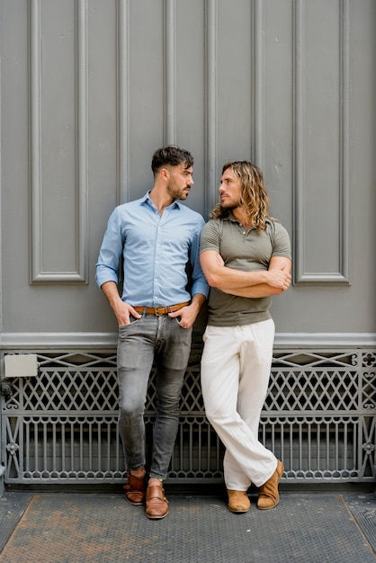 Young handsome males posing together