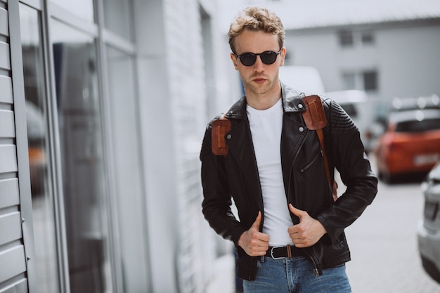 Free photo young handsome man model posing in the street