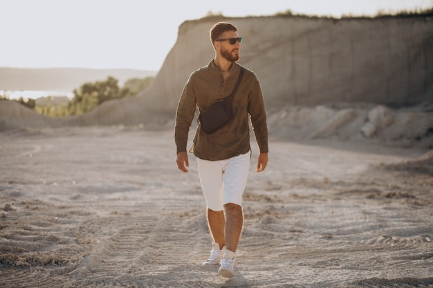 Young handsome man in a quarry alone